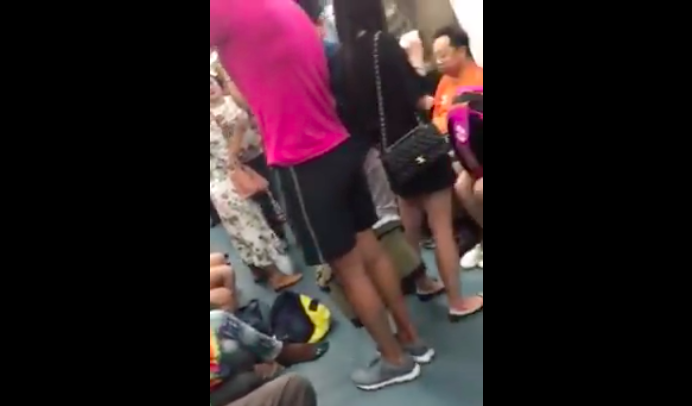 Screen shot of the video on Facebook of the incident showing a man allegedly taking an upskirt video of a woman. (Photo: Facebook video)