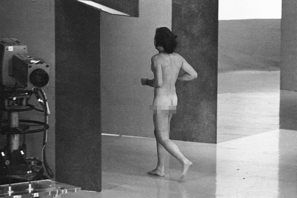 (Original Caption) 04/02/1974-Hollywood, CA- Moments after the Best Actor award presentation at the 46th Academy Awards ceremonies, a male streaker ran nude before a TV audience of 76 million people; he was seen on TV only above the waist and behind David Niven who said "That was bound to happen." Next to appear on stage (not shown) was presenter Elizabeth Taylor, who laughinlgly found it not too hard an act to follow.