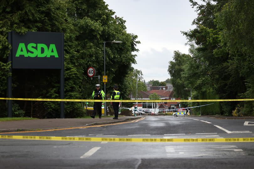 The road was cordoned off outside the Asda supermarket