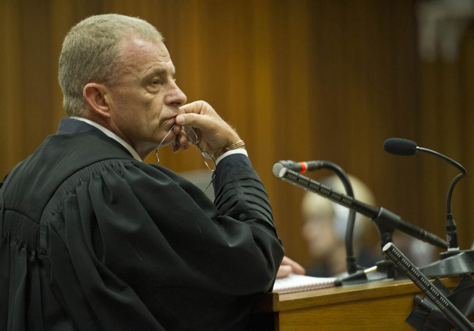 State prosecutor, Gerrie Nel, questions Oscar Pistorius in court in Pretoria, South Africa, Friday, April 11, 2014. Pistorius is charged with the murder of his girlfriend Reeva Steenkamp, on Valentines Day in 2013. (AP Photo/Craig Nieuwenhuizen, Pool)