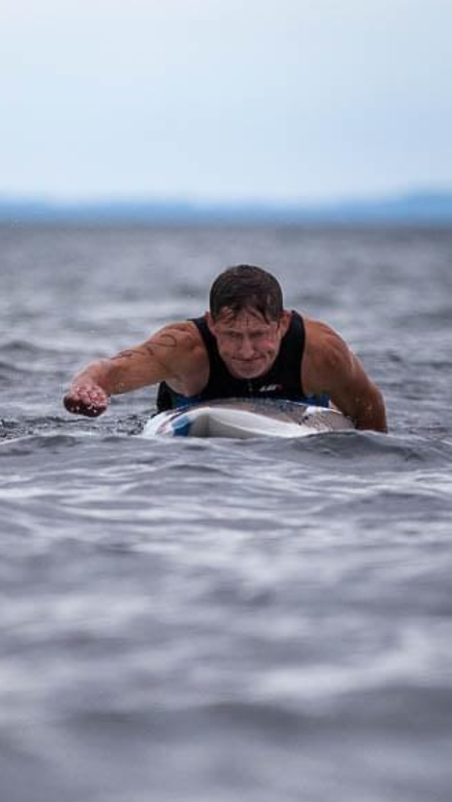 Daniel Novák, a John Deere construction equipment salesman from Traverse City, paddling prone board at Rapa Nui 2019 in Traverse City, is a key organizer behind the Belle Isle Classic 2022 race off Belle Isle in July. His motto is, "Does not matter how fast, how far or what boat or board you paddle.  As long as you paddle you belong."