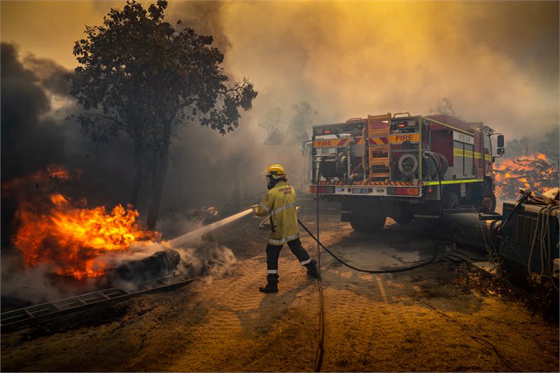 Pictured is a firefighter battling the Oakford fire in Western Australia.