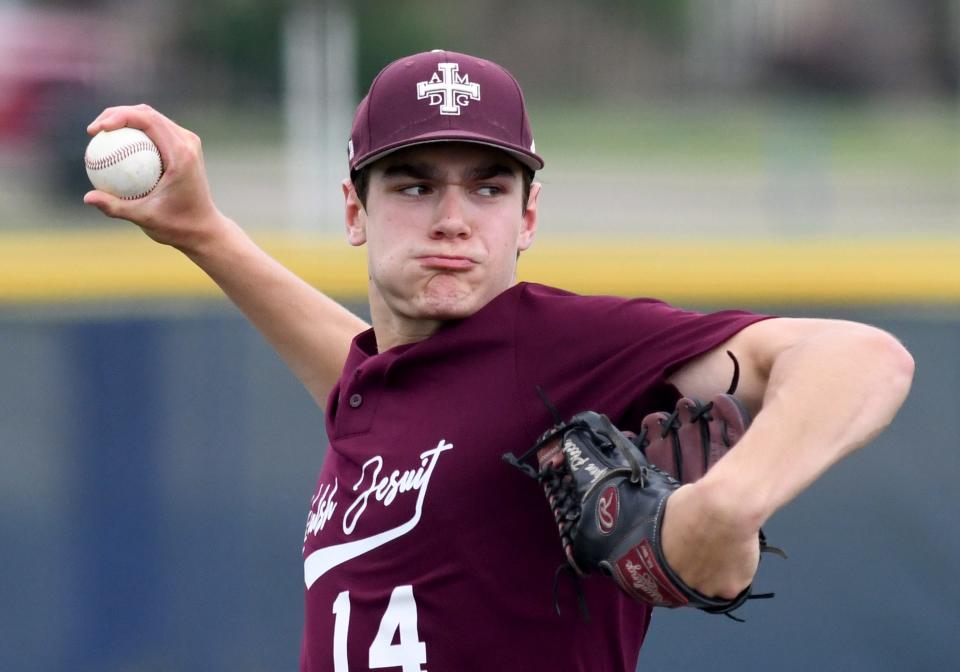 Walsh Jesuit pitcher Ryan Piech delivers a pitch in the second inning against North Canton Hoover in a Division I regional semifinal at Louisville High School on Thursday, June 2, 2022.