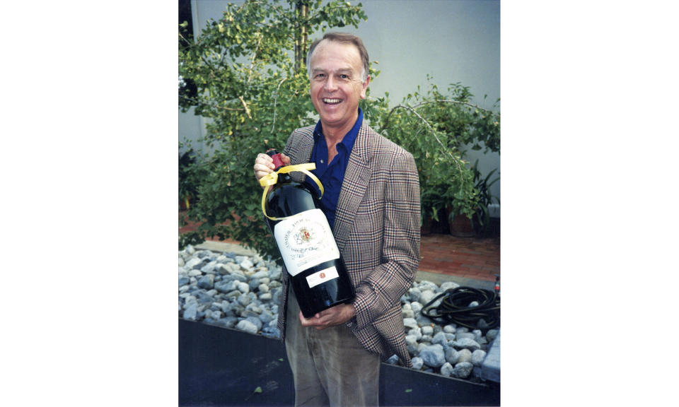 This circa 1985 photo provided by Esme Gibson shows Joe Coulombe, the founder of the Trader Joe's market chain, at his home in Pasadena, Calif. Coulombe, the man who created Trader Joe's markets with a vision that college-educated but poorly paid young people would buy healthy foods if they could only afford them, has died. Coulombe's family says he died Friday, Feb. 28, 2020 at age 89. He opened the first of his quirky, nautically themed markets in Pasadena, California, in 1967. He stocked it with granola, organic foods and other items he bought directly from suppliers to hold prices down. Trader Joe's now has more than 500 stores in over 40 states. (Image by Esme via AP)