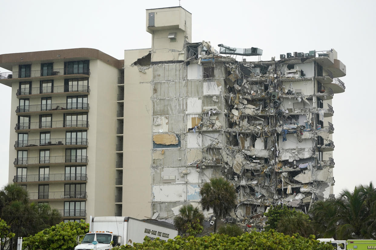 A view of a building is shown after a partial collapse, Thursday, June 24, 2021, in Surfside, Fla. A wing of a 12-story beachfront condo building collapsed with a roar in a town outside Miami early Thursday, trapping residents in rubble and twisted metal. (AP Photo/Wilfredo Lee)