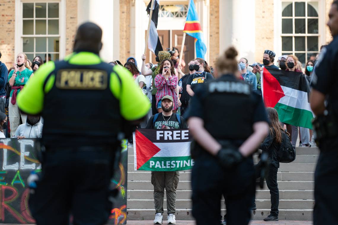 A line of police face a group of protestors outside of South Building on the morning of Tuesday, April 30. The protestors continued to stand for their cause after arrests had been made at the “pro-Palestine encampement” earlier that morning. Heather Diehl