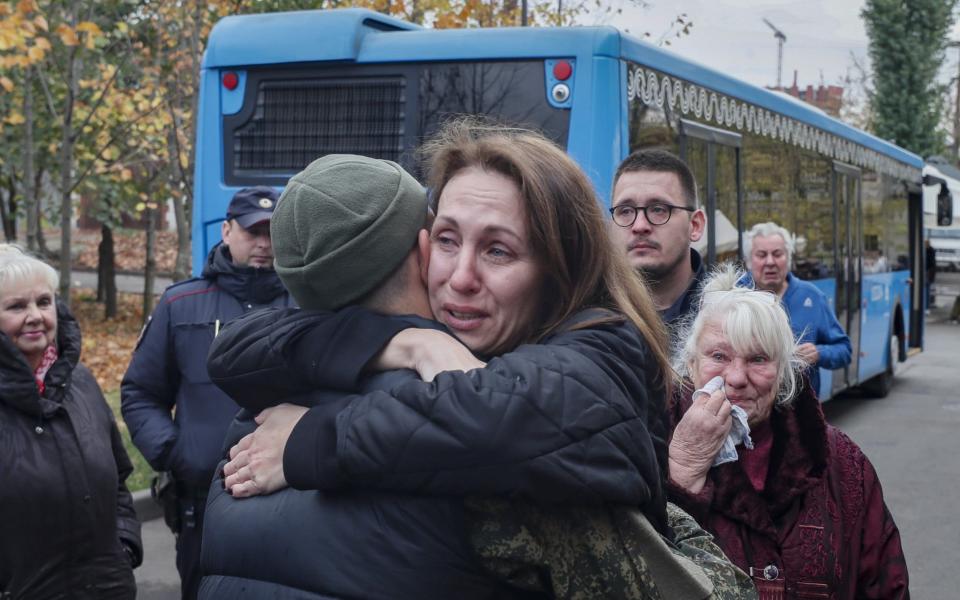 Russian conscripted man says goodbye to a relative at a recruiting office in Moscow - YURI KOCHETKOV/EPA-EFE/Shutterstock/Shutterstock