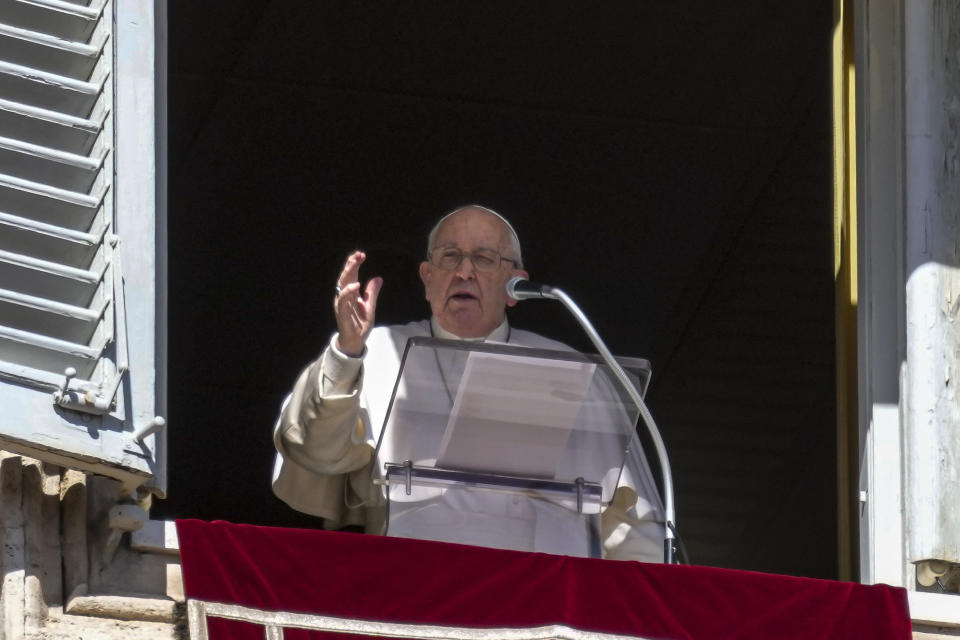 Pope Francis appears at the window of his studio overlooking St. Peter's Square at The Vatican for the traditional Sunday noon blessing of faithful and pilgrims gathered in the Square for the Angelus prayer, Sunday, Feb. 25, 2024. Pope Francis had canceled an audience scheduled for Saturday as a precaution after coming down with mild flu, the Vatican press office said in a short statement, without adding further details. (AP Photo/Gregorio Borgia)