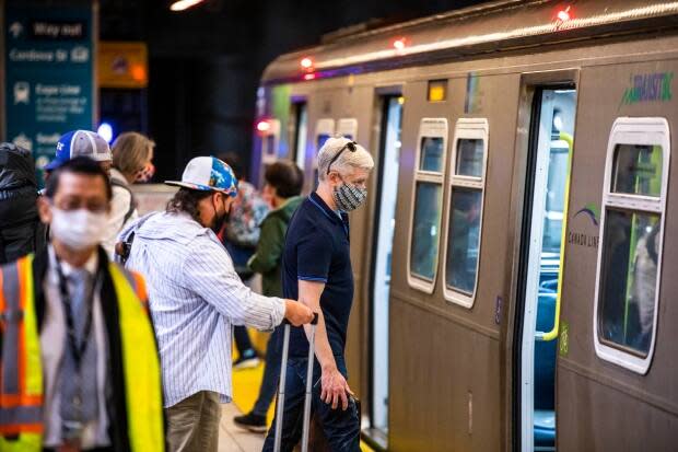 People ride the Skytrain on the first day of Translink’s mandatory mask rule in Vancouver on Aug. 24, 2020. 