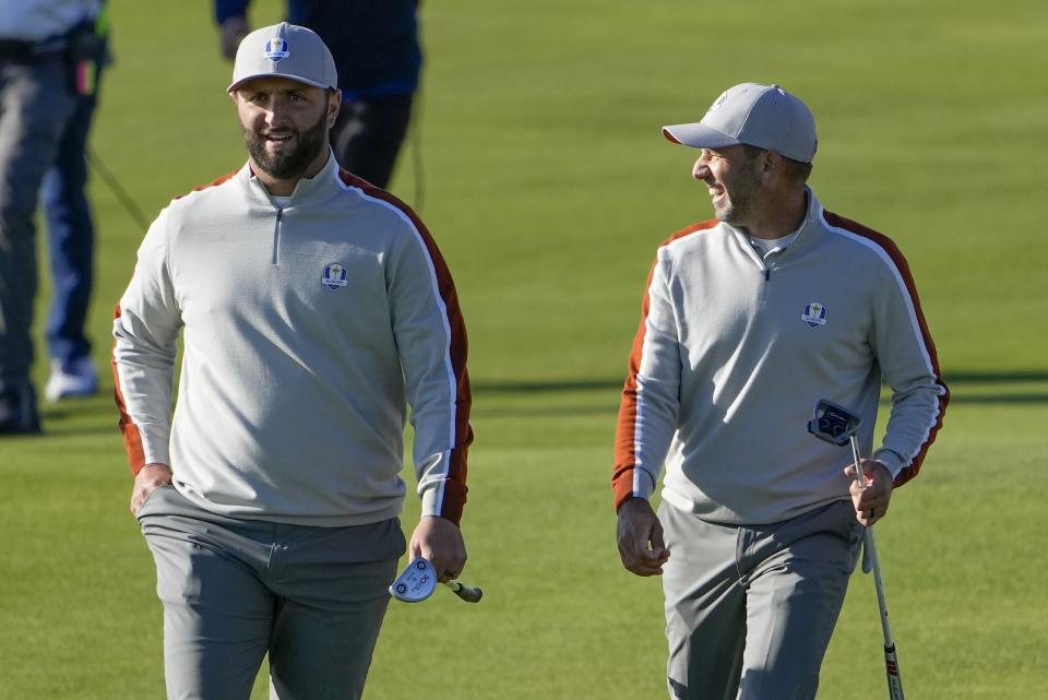 Team Europe's Sergio Garcia and Team Europe's Jon Rahm walk to the eighth hole during a foursomes match the Ryder Cup at the Whistling Straits Golf Course Saturday, Sept. 25, 2021, in Sheboygan, Wis. (AP Photo/Jeff Roberson)