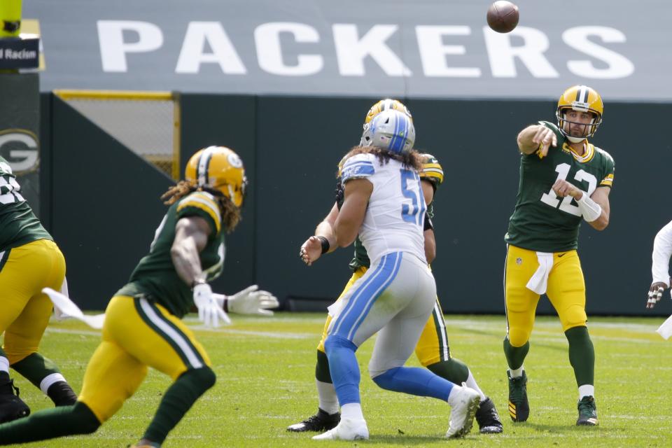 Green Bay Packers' Aaron Rodgers throws during the first half of an NFL football game against the Detroit Lions Sunday, Sept. 20, 2020, in Green Bay, Wis. (AP Photo/Mike Roemer)