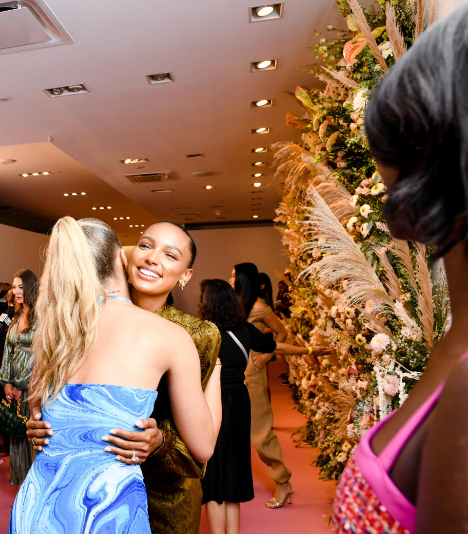 Jasmine Sanders hugs Jasmine Tookes at the Revolve Gallery during New York Fashion Week, Sept. 9, 2021. - Credit: Joe Schildhorn/BFA.com