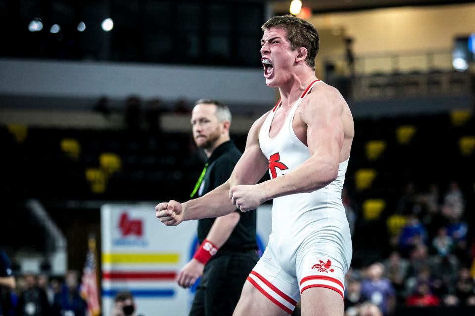 Iowa City High's Ben Kueter celebrates after getting a takedown in sudden victory at 220 pounds during the finals of the Dan Gable Donnybrook wrestling tournament on Saturday at the Xtream Arena in Coralville, Iowa.