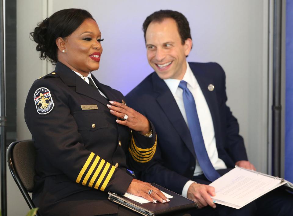 LMPD Chief Jacquelyn Gwinn-Villaroel shares a laugh with Mayor Craig Greenberg prior to her swearing in ceremony on Friday, August 25, 2023, at the Muhammad Ali Center.