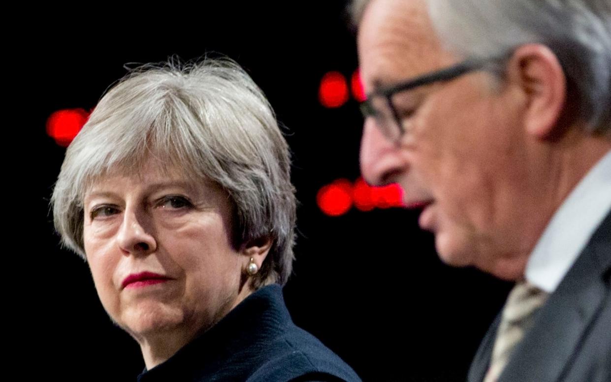 Theresa May may not be impressed with Jean-Claude Juncker's letter to Vladimir Putin. - AP
