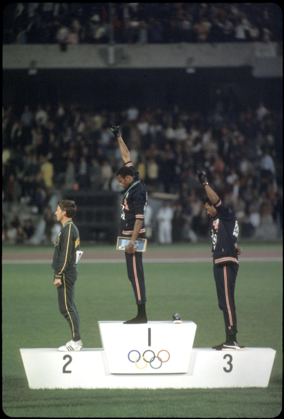 Tommie (1st place) and John Carlos (3rd place) of the USA raise their fists in the Black Power Salute during the playing of the national anthem at the Olympics in Mexico City, Mexico