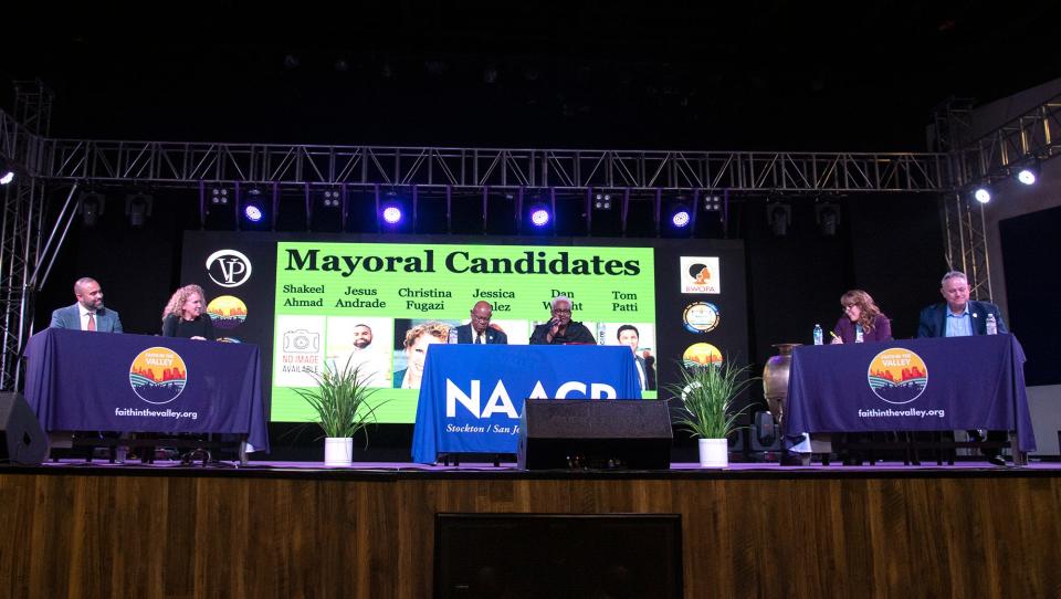 Candidates Jesus Andrade, left, Christian Fugazi, moderators Stockton NAACP president Bobby Bivens, pastor Trena Turner, candidates, Jessica Valez, and Dan Wright participate in a Stockton mayoral candidates forum at the Victory in Praise church in Stockton on Feb. 1, 2024.