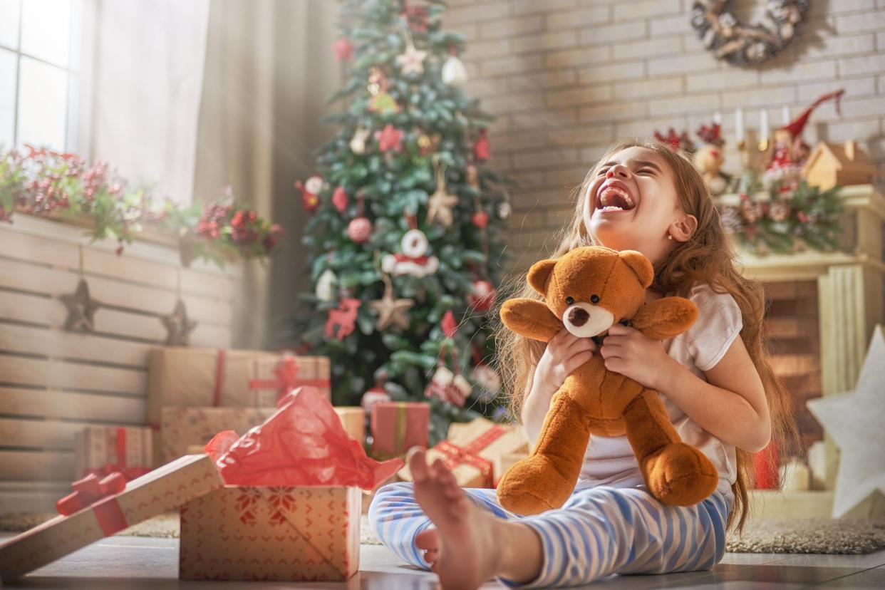 child opening Christmas present