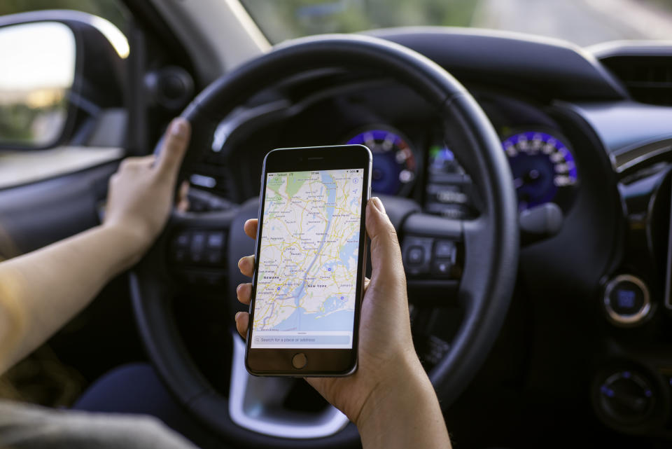 İstanbul, Turkey - November 1, 2016: Woman hand holding an Apple iPhone 6  Plus displaying Maps application in a car. iPhone 6 Plus is a smart phone produced by Apple Computer, Inc