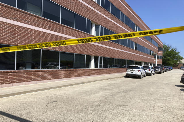 Crime scene tape blocks the Fairfax, Va., office building where police say a man wielding a baseball bat attacked two staffers for U.S. Rep. Gerry Connolly, D-Va., on Monday morning, May 15, 2023. (AP Photo/Matthew Barakat)