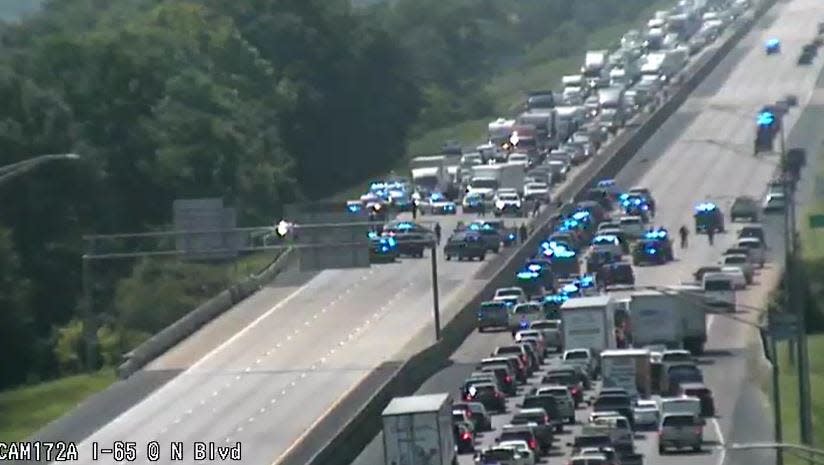 A screen capture of the ALDOT traffic livestream shows law enforcement gathered on I-65 near the Northern Boulevard exit at 2:55 p.m.