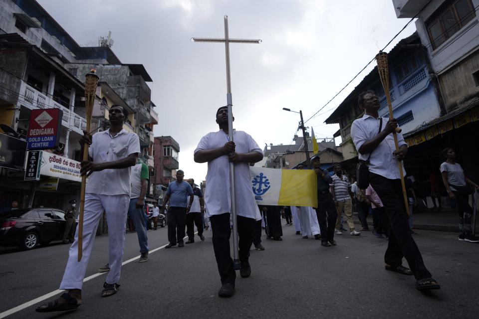 Sri Lankan Catholics take out a silent protest march to mark the fourth year commemoration of the 2019, Easter Sunday bomb attacks on Catholic Churches, in Colombo, Sri Lanka, Friday, April 21, 2023. Thousands of Sri Lankans held a protest in the capital on Friday, demanding justice for the victims of the 2019 Easter Sunday bomb attacks that killed nearly 270 people. (AP Photo/Eranga Jayawardena)