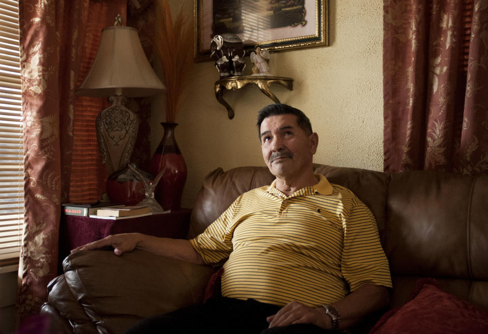Medal of Honor recipient Santiago Erevia, is photographed on Saturday, Feb. 22, 2014, at his home in San Antonio, Texas. Erevia is one of twenty-four army veterans who will receive the award following a congressionally mandated review conducted to ensure that eligible award recipients were not bypassed due to prejudice. (AP Photo/Darren Abate)