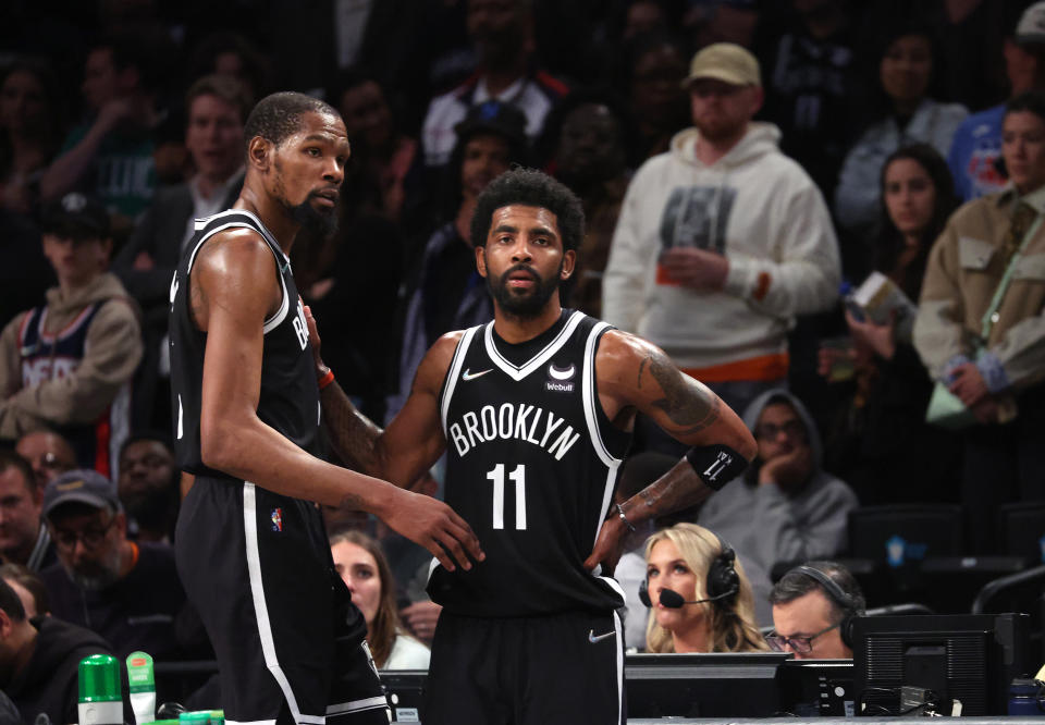 NEW YORK, NEW YORK - APRIL 23:  Kevin Durant #7 and Kyrie Irving #11 of the Brooklyn Nets look on in the final seconds of their 109-103 loss against the Boston Celtics during Game Three of the Eastern Conference First Round NBA Playoffs at Barclays Center on April 23, 2022 in New York City.  NOTE TO USER: User expressly acknowledges and agrees that, by downloading and or using this photograph, User is consenting to the terms and conditions of the Getty Images License Agreement.  (Photo by Al Bello/Getty Images).