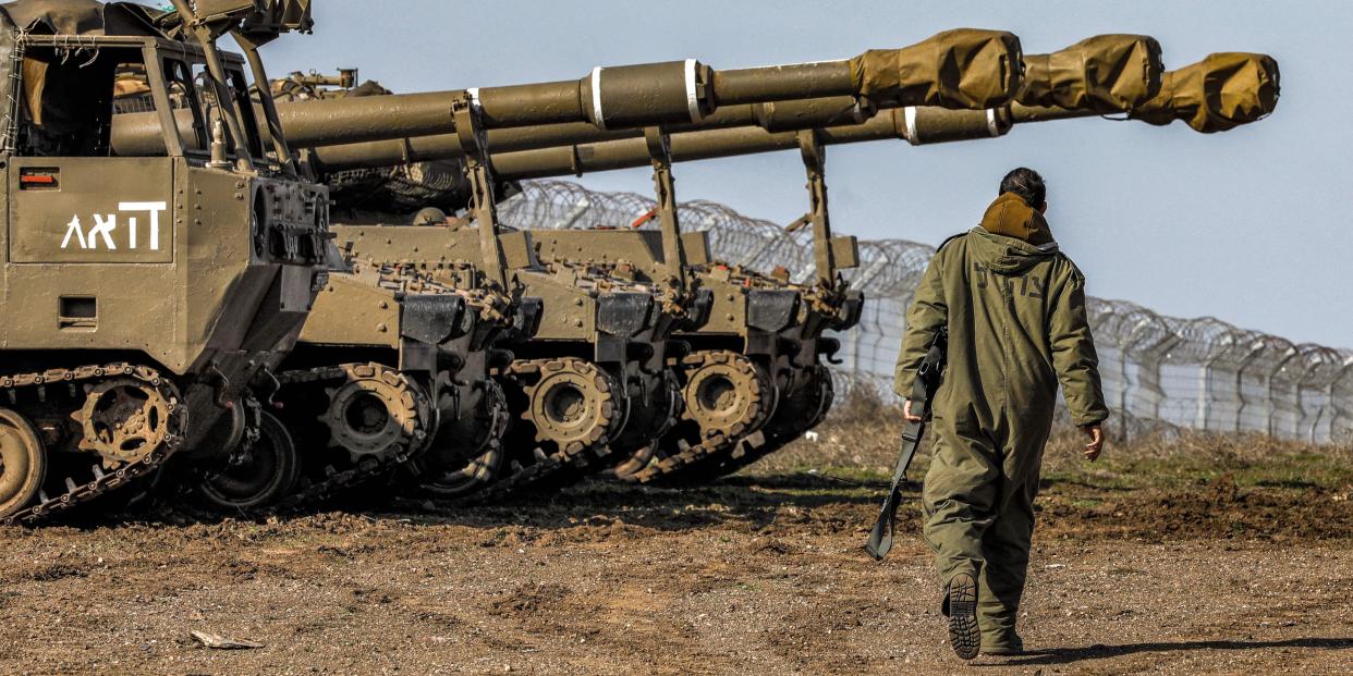 Israeli army M109 155mm self-propelled howitzers are positioned in the Israeli-annexed Golan Heights near the Syria border on January 2, 2023.