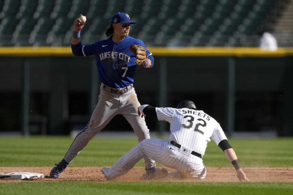 Kansas City Royals shortstop Bobby Witt Jr. forces out Chicago White Sox's Gavin Sheets at second but is unable to turn the double play during the first inning in the first baseball game of a doubleheader, Tuesday, Sept. 12, 2023, in Chicago. (AP Photo/Charles Rex Arbogast)