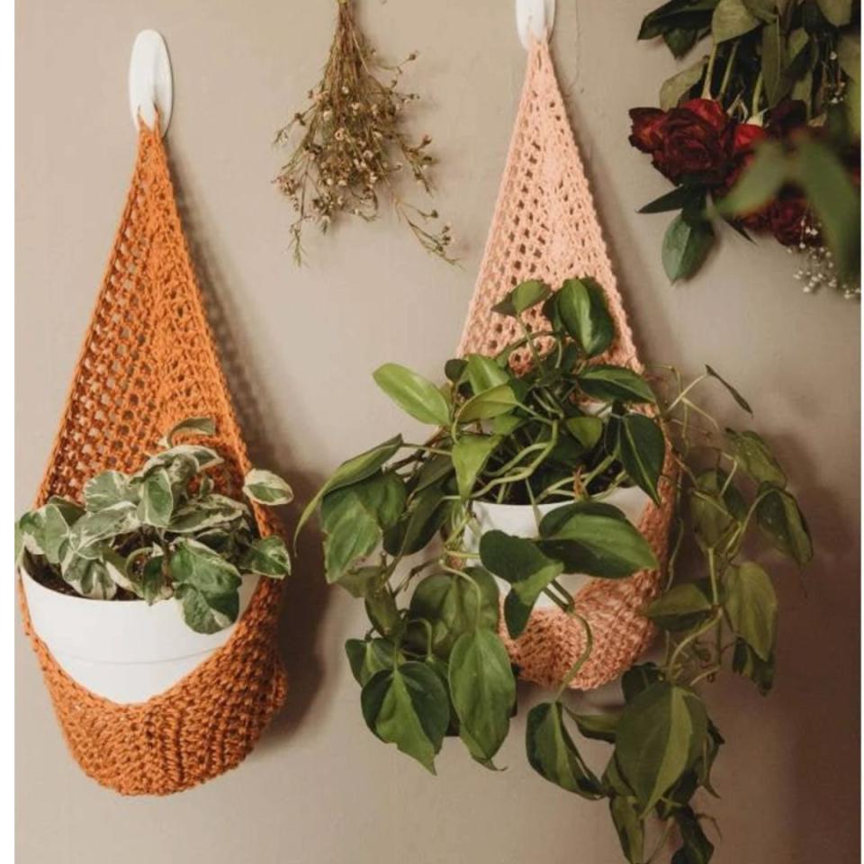 A true plant lover's home wouldn't be complete without a macrame plant hanger, and these customizable options are hand-woven and the perfect addition to an empty wall space. Choose from over 40 colors and two sizes that can accommodate pots up to 10 inches in diameter.You can buy a hanging macrame wall planter from Etsy for around $16.