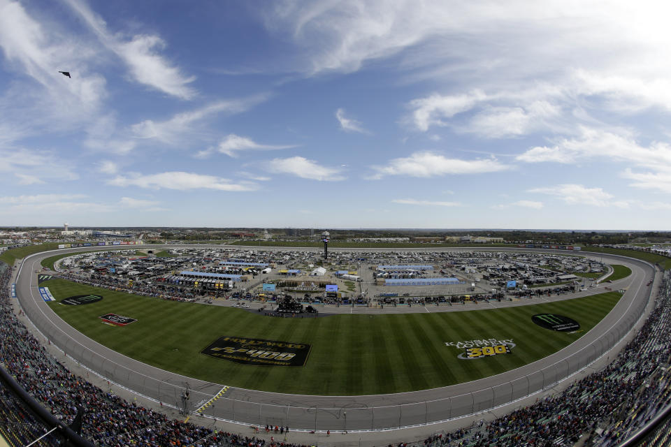 A B-2 Stealth bomber flies by before a NASCAR Cup Series auto race at Kansas Speedway in Kansas City, Kan. Sunday, Oct. 20, 2019. (AP Photo/Charlie Riedel)