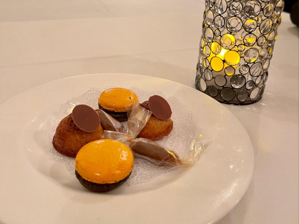 Plate of small desserts including macarons.