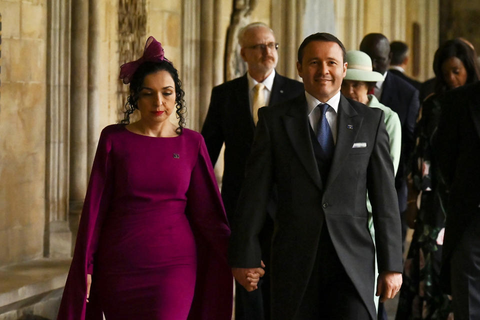 <p>LONDON, ENGLAND - MAY 06: Kosovo President Vjosa Osmani (L) and her husband Prindon Sadriu arrive to take their seats ahead of the Coronation of King Charles III and Queen Camilla on May 6, 2023 in London, England. The Coronation of Charles III and his wife, Camilla, as King and Queen of the United Kingdom of Great Britain and Northern Ireland, and the other Commonwealth realms takes place at Westminster Abbey today. Charles acceded to the throne on 8 September 2022, upon the death of his mother, Elizabeth II. (Photo by Ben Stansall - WPA Pool/Getty Images)</p> 