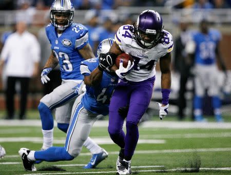 Dec 14, 2014; Detroit, MI, USA; Minnesota Vikings wide receiver Cordarrelle Patterson (84) gets tackled by Detroit Lions linebacker Julian Stanford (49) during the fourth quarter at Ford Field. Lions win 16-14. Mandatory Credit: Raj Mehta-USA TODAY Sports