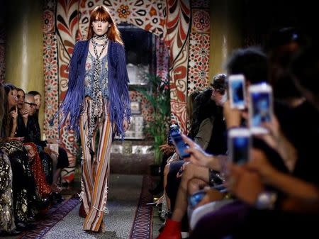 A model presents a creation at the Roberto Cavalli fashion show during Milan Fashion Week Spring/Summer 2017 in Milan, Italy, September 21, 2016. REUTERS/Alessandro Garofalo