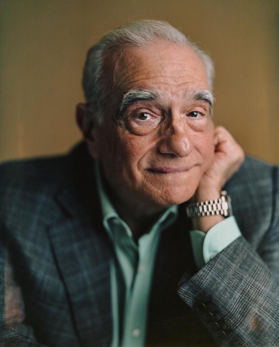 Director Martin Scorsese leans his chin on his hand for a portrait.