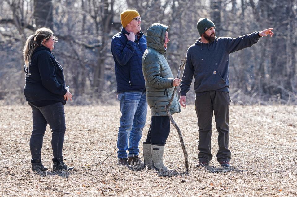 Volunteers search along the river near the intersection of Eaton-Wheeling Pike and Walnut St. for missing child Scottie Dean Morris, in Eaton Ind. on Monday March 20, 2023. Morris, 14, left his family's home in Eaton about 8:30 p.m. Thursday, March 16, 2023, and has not been seen since.