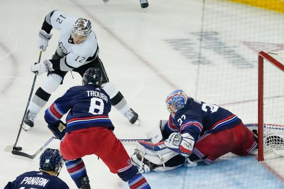 New York Rangers goaltender Jonathan Quick (32) stretches to save a shot by Los Angeles Kings left wing Trevor Moore (12) during the second period of an NHL hockey game in New York, Sunday, Dec. 10, 2023.