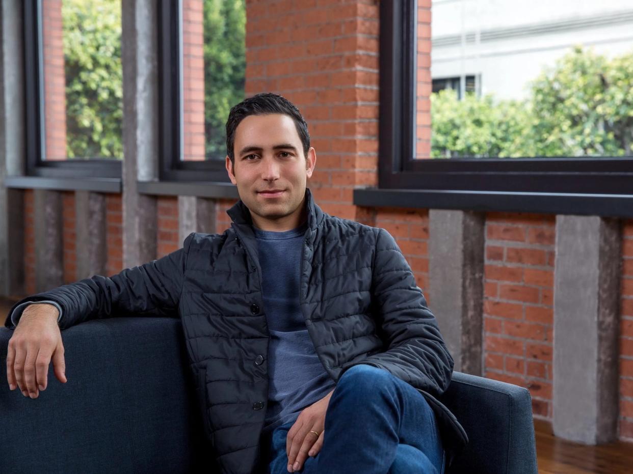 Scott Belsky, chief product officer at Adobe Creative Cloud, poses for a photo in an office.