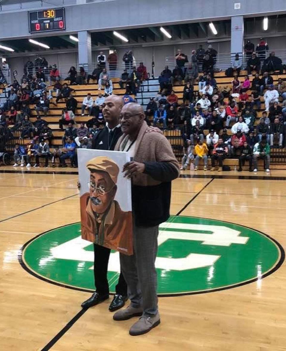 When Steve Hall, left, was a 10th grader on the varsity basketball team at Cass Technical High School, Willie "Roy" Ogletree recalls patiently answering questions that Hall had about the history of Cass Tech basketball, while driving Hall back to Cass following a game at Mumford High School. More than 30 years later, on Dec. 27, 2019, Hall, now the boys basketball coach at Cass, showed his appreciation for Ogletree's continued support of the program by presenting him with a portrait of Ogletree created by John Baker III, who was Hall's teammate on the Cass basketball team.