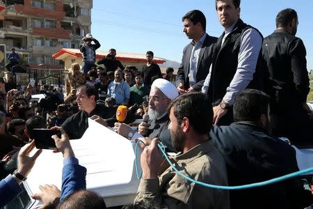 Iranian President Hassan Rouhani speaks as he visits Sarpol-e Zahab county in Kermanshah that was hit by a powerful earthquake, Iran November 14, 2017. President.ir/Handout via REUTERS