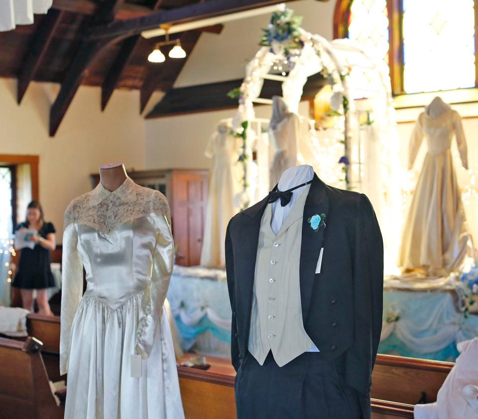 Shirley O’Donnell's wedding dress is shown alongside Bertram O’Donnell's wedding outfit from 1952. The garments will be on display in the Marshfield Historical Society's wedding exhibit. Monday, May 16, 2022.