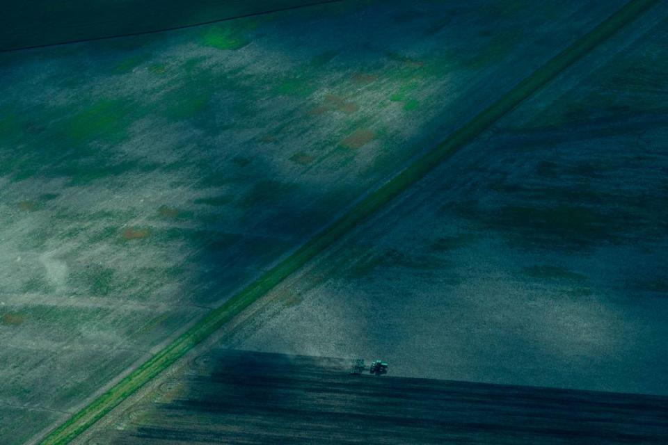 A tractor tills farmland seen during a Lighthawk flight on April 24 in Illinois.