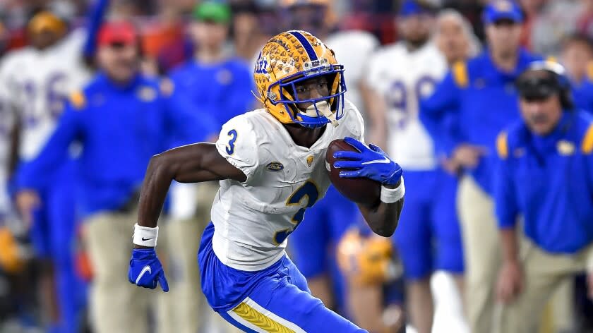 FILE - Pittsburgh wide receiver Jordan Addison runs with the ball during the second half.