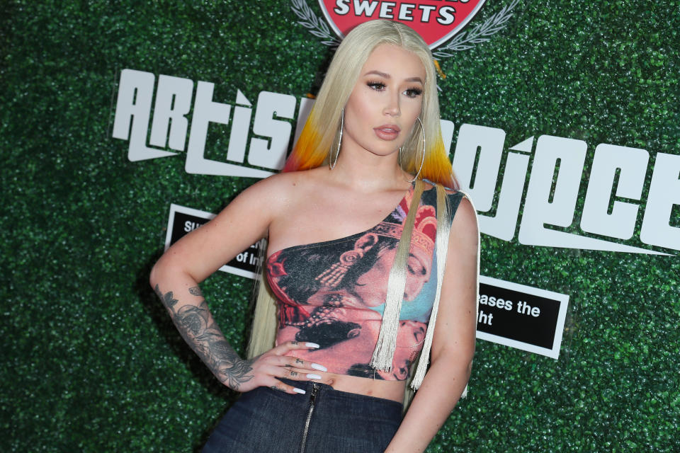 Iggy Azalea before welcoming secret baby and posing in neon bikini