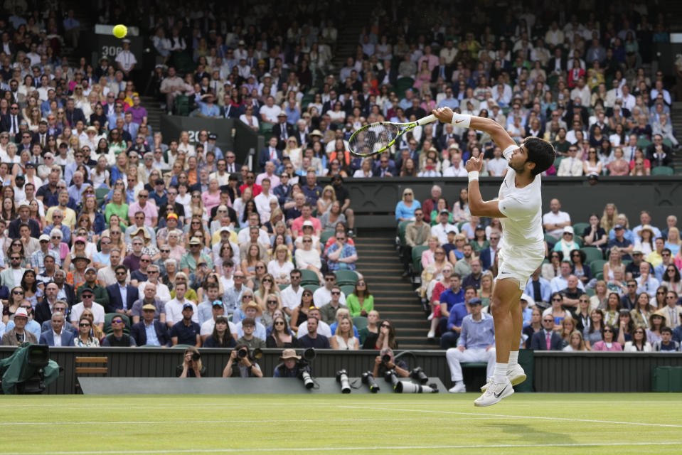 Spain's Carlos Alcaraz smashes a return to Serbia's Novak Djokovic in the final of the men's singles on day fourteen of the Wimbledon tennis championships in London, Sunday, July 16, 2023. (AP Photo/Kirsty Wigglesworth)