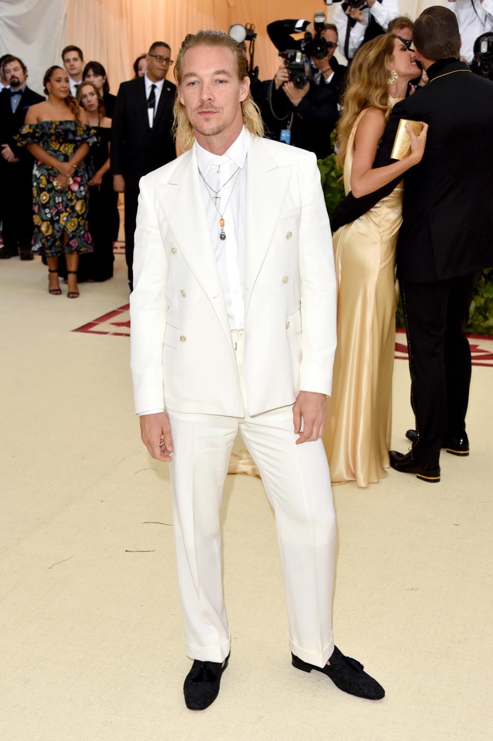 <h1 class="title">Diplo in Maison Margiela, Christian Louboutin shoes, and Mikimoto jewelry</h1><cite class="credit">Photo: Getty Images</cite>
