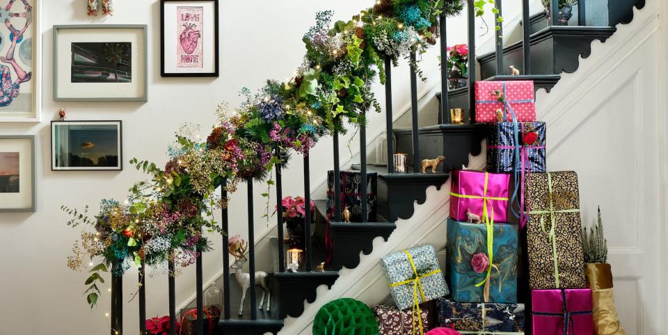 christmas hallway decorations with wreath hanging above mirror