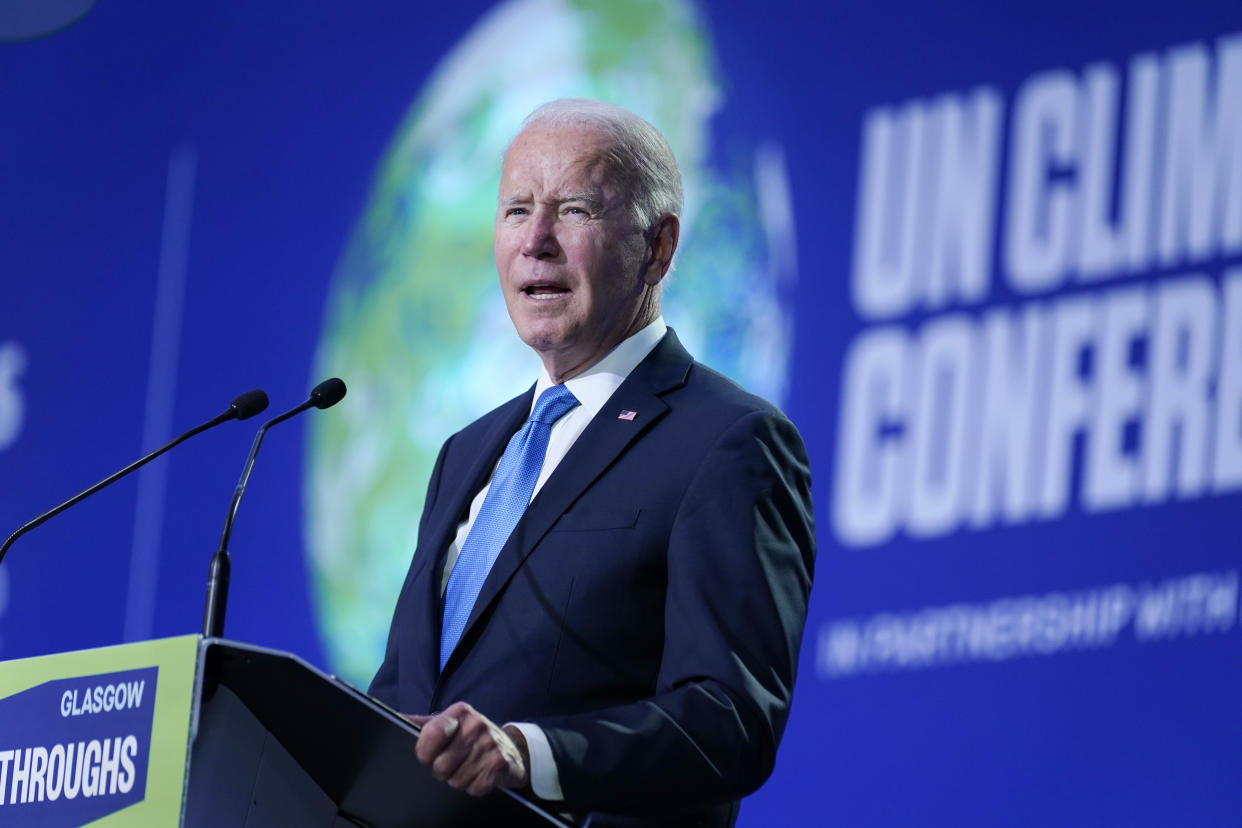 President Joe Biden, with UN Climate Conference projected behind him, at a podium marked Glasgow.